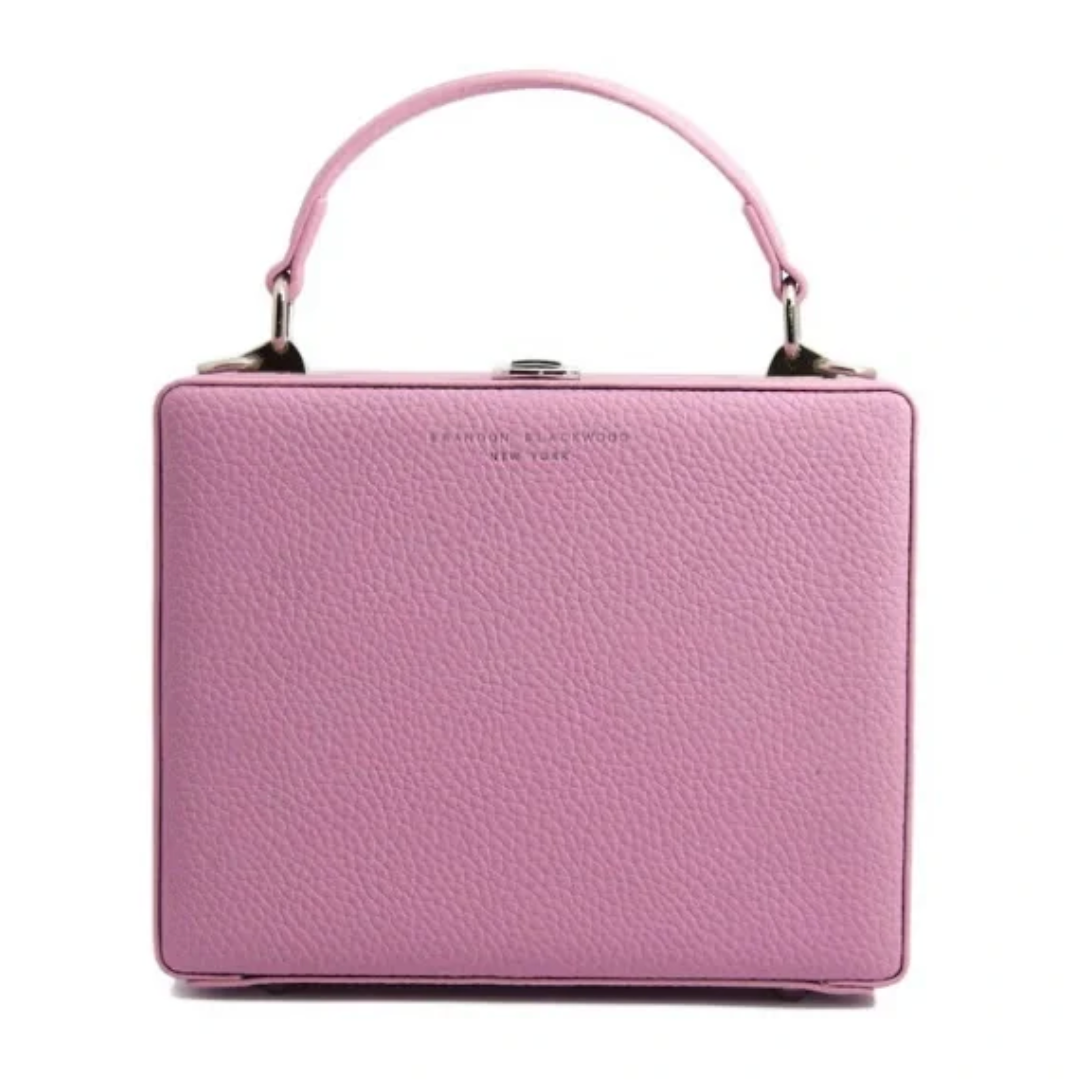 Pink handbag with a visible brand name on a white background